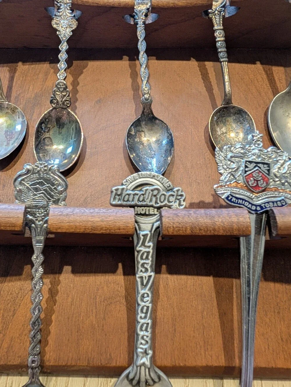 Vintage Decorative Souvenir Spoon Set on Wooden Display